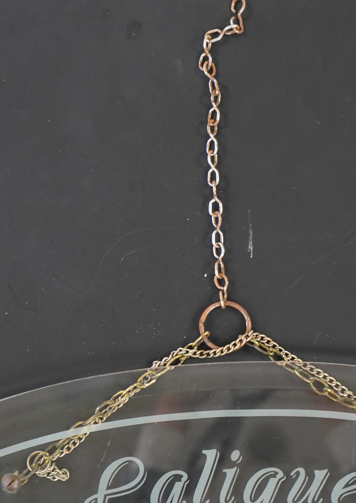 A rare boutique advertising hanging glass sign for Lalique